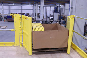 photo of self-closing pallet gate with pallet pushed through

